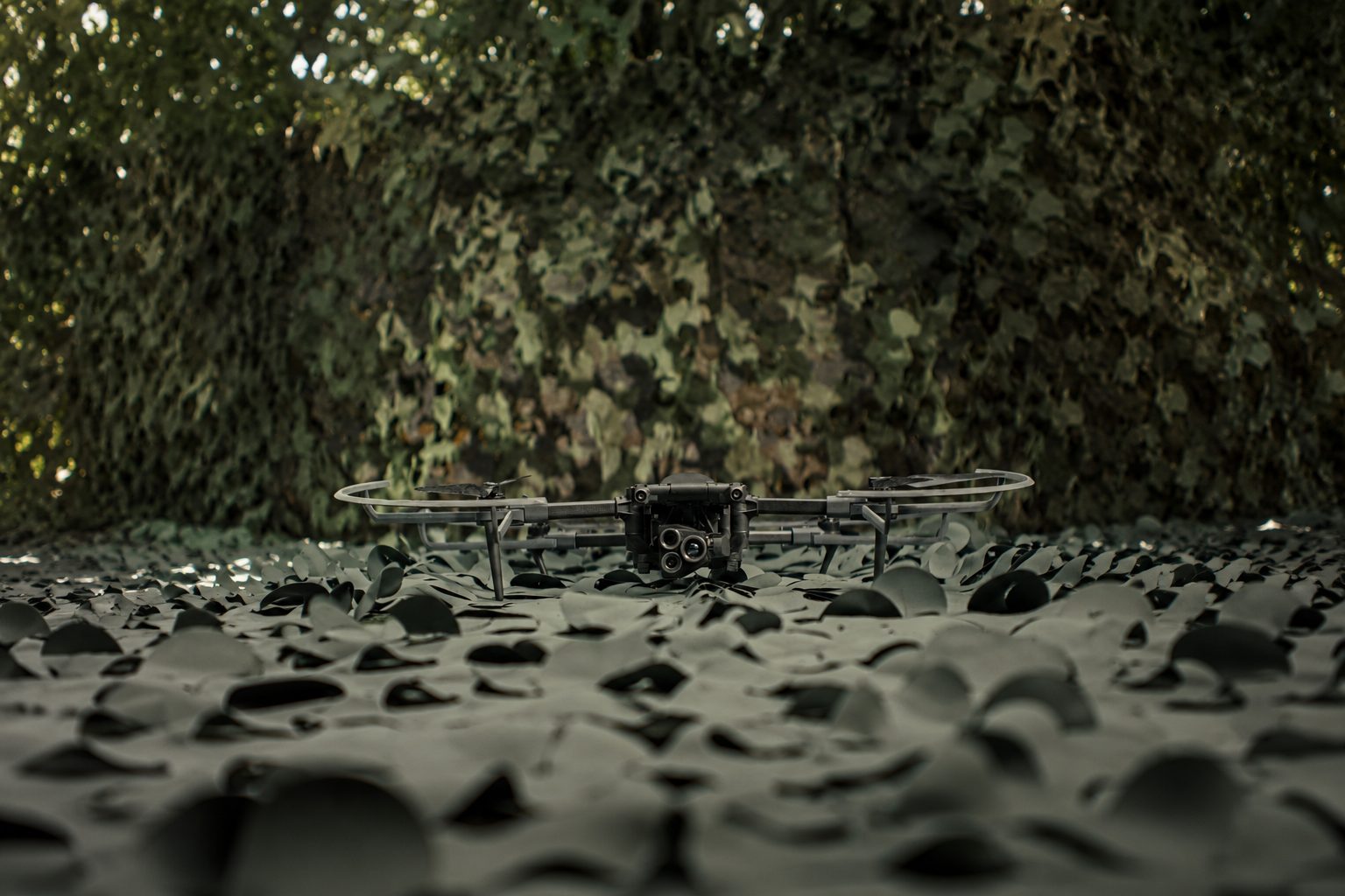 Drone under camouflage netting